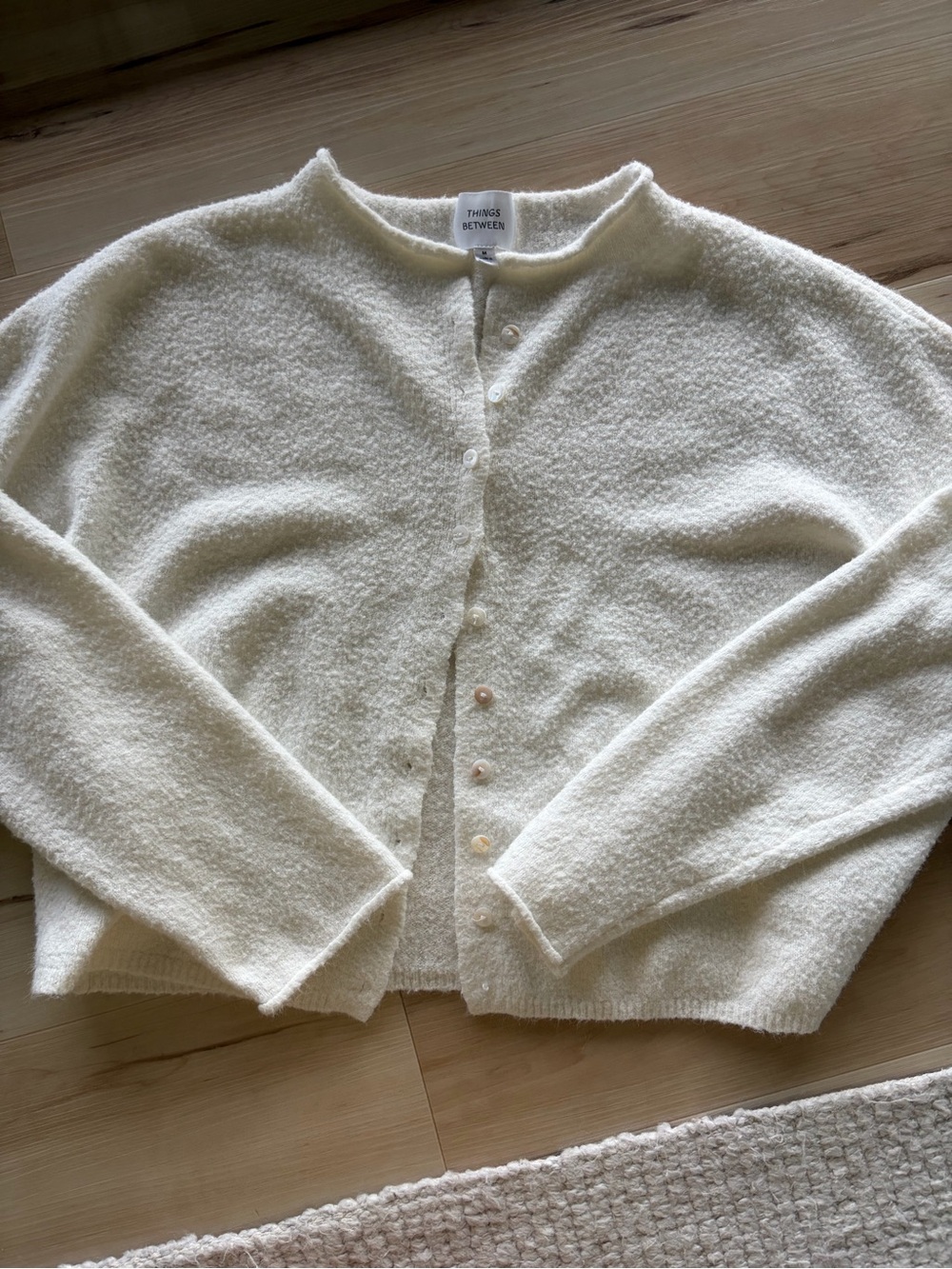 White things between cardigan